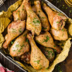 smoked chicken legs in a metal tray