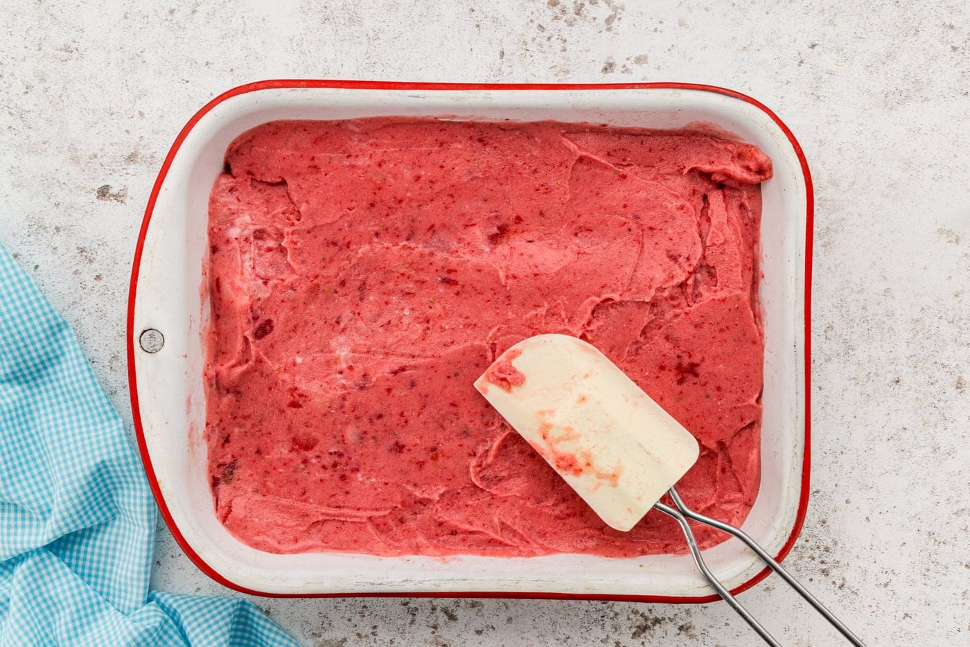 Strawberry Frozen Yogurt spread into pan