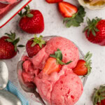 overhead photo of a dish of Strawberry Frozen Yogurt with strawberries