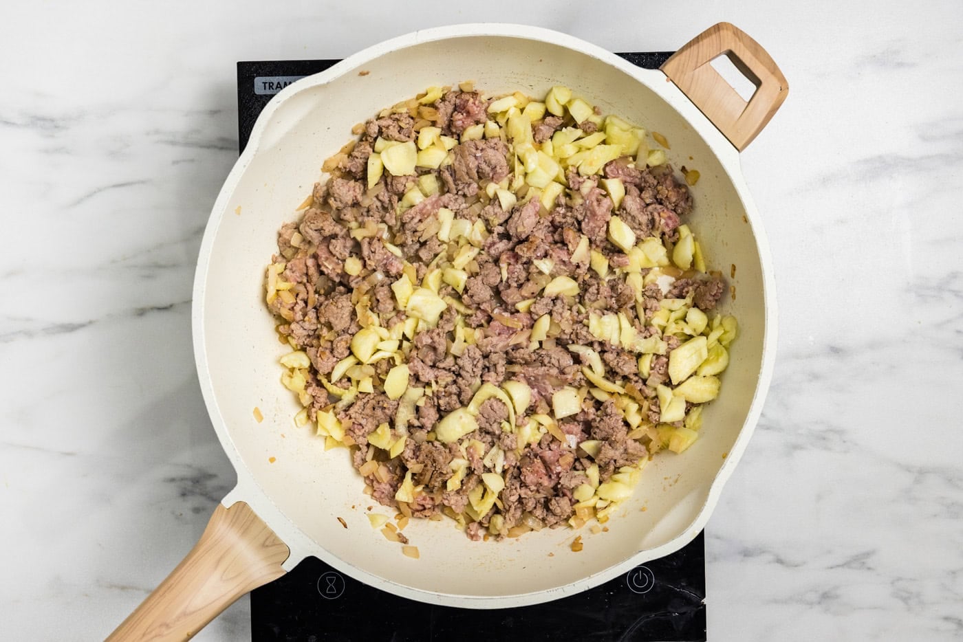 ground turkey and zucchini pulp in skillet