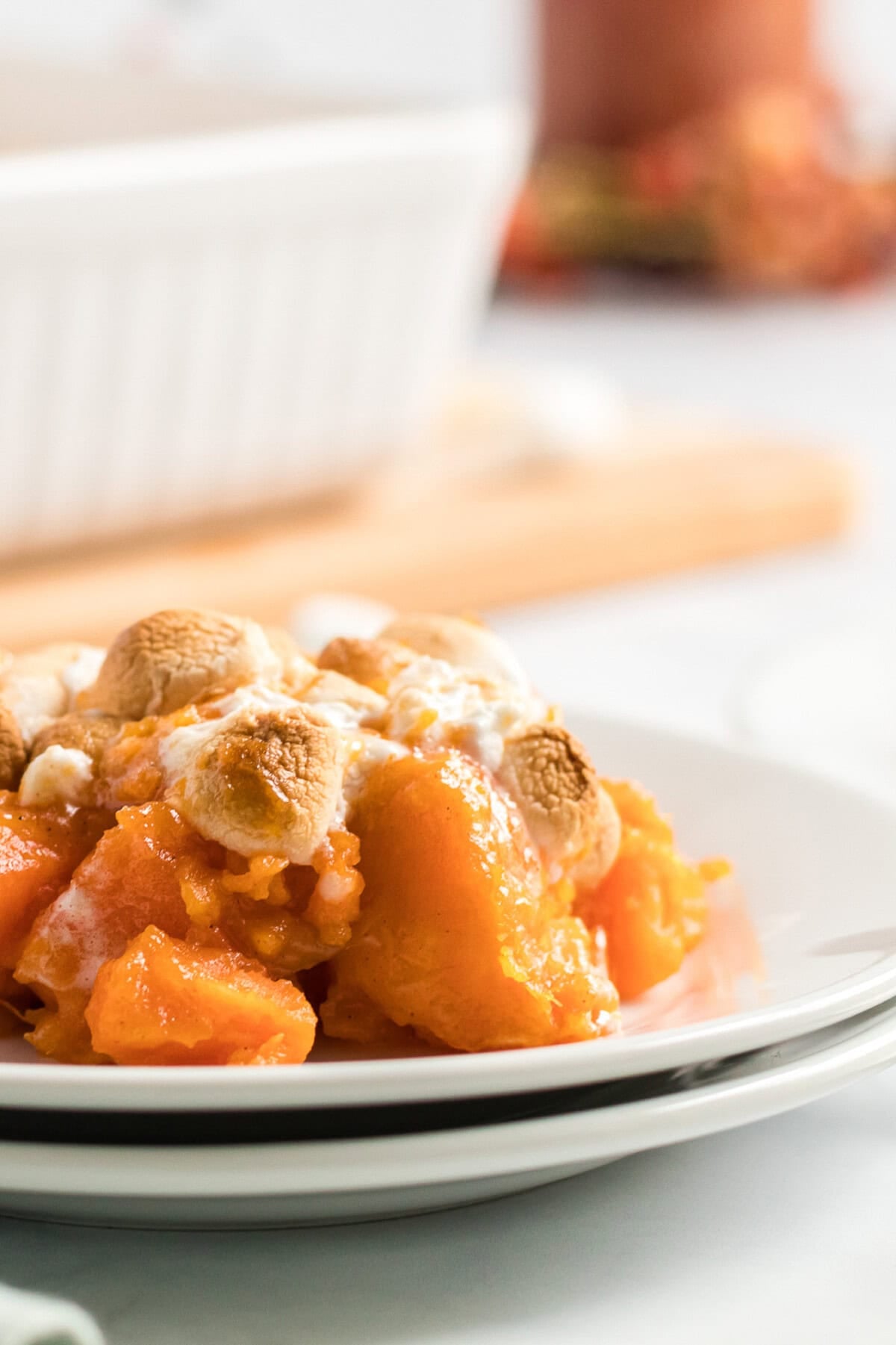 plate with a portion of candied yams with marshmallows