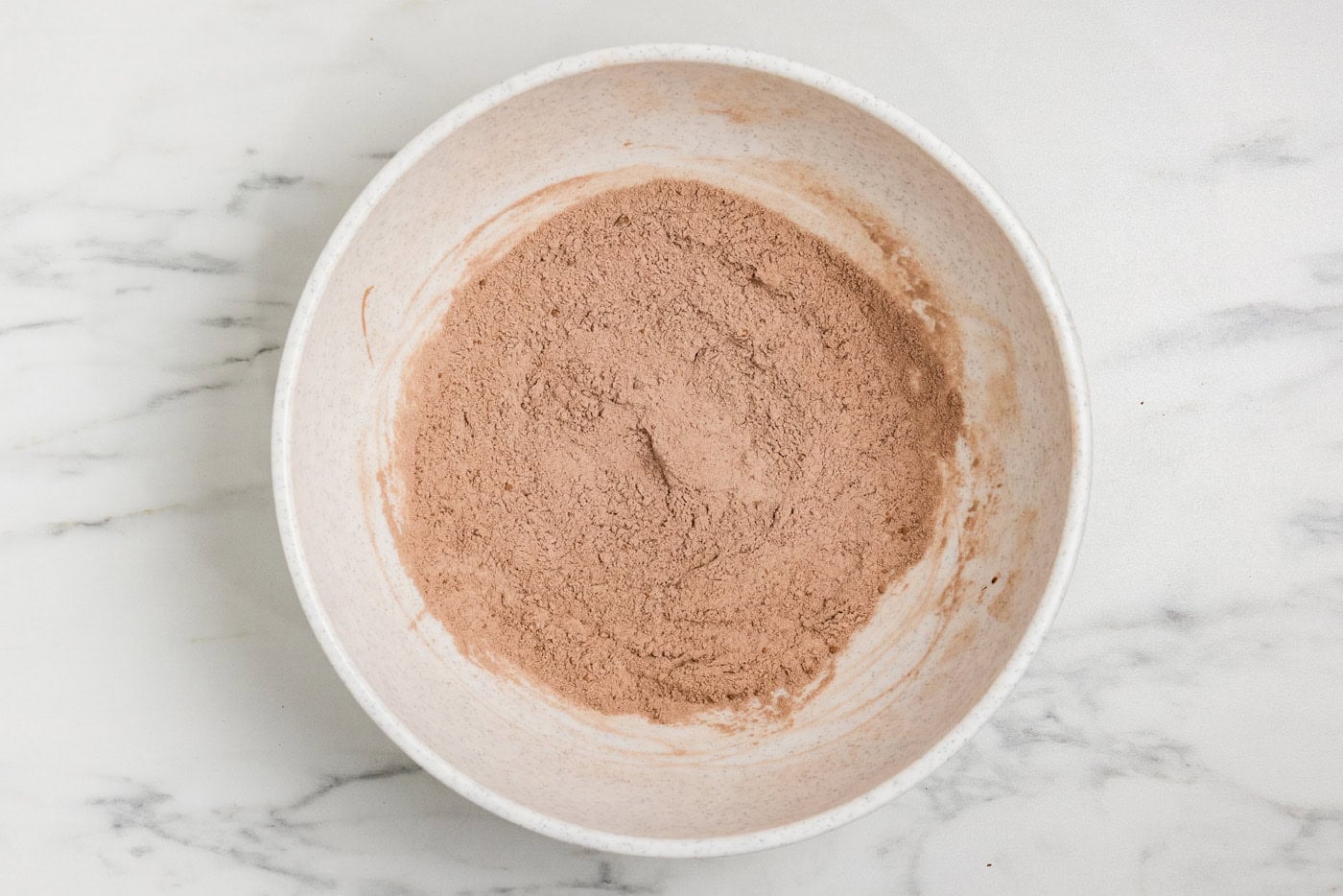 dry ingredients for Double Chocolate Zucchini Muffins in bowl