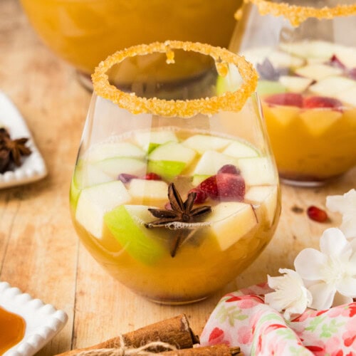 glass of Apple Cider Sangria with pomegranate arils and star anise