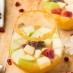 glass of Apple Cider Sangria with another glass behind it