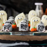 Halloween dirt cake with cookie tombstones and white chocolate ghosts