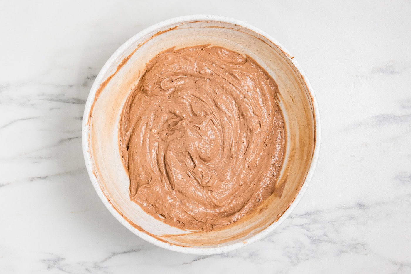 Chocolate pudding and cream cheese folded into a smooth light brown filling