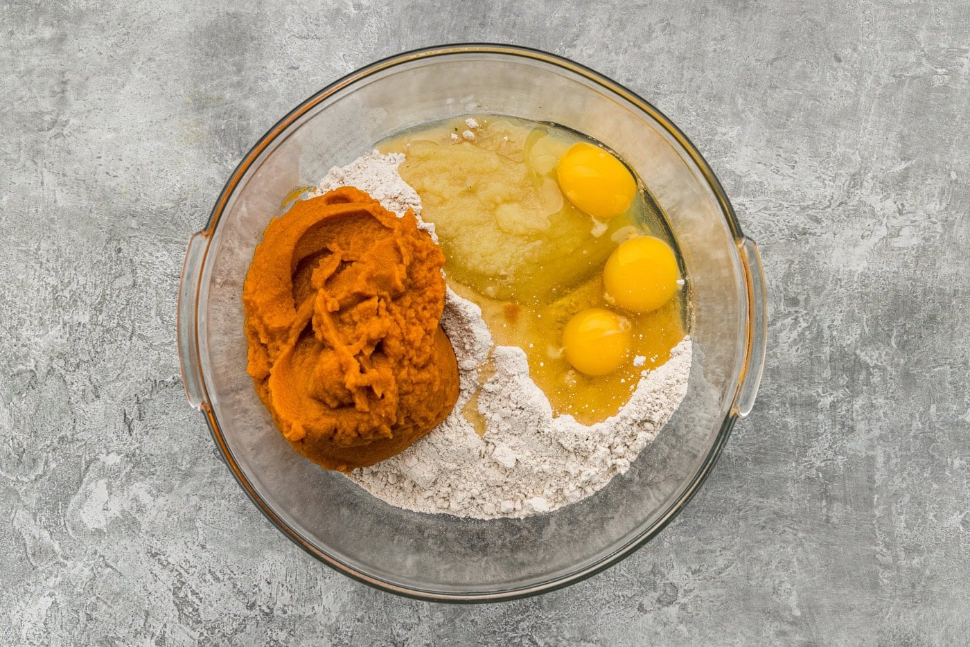 cake batter with pumpkin in bowl