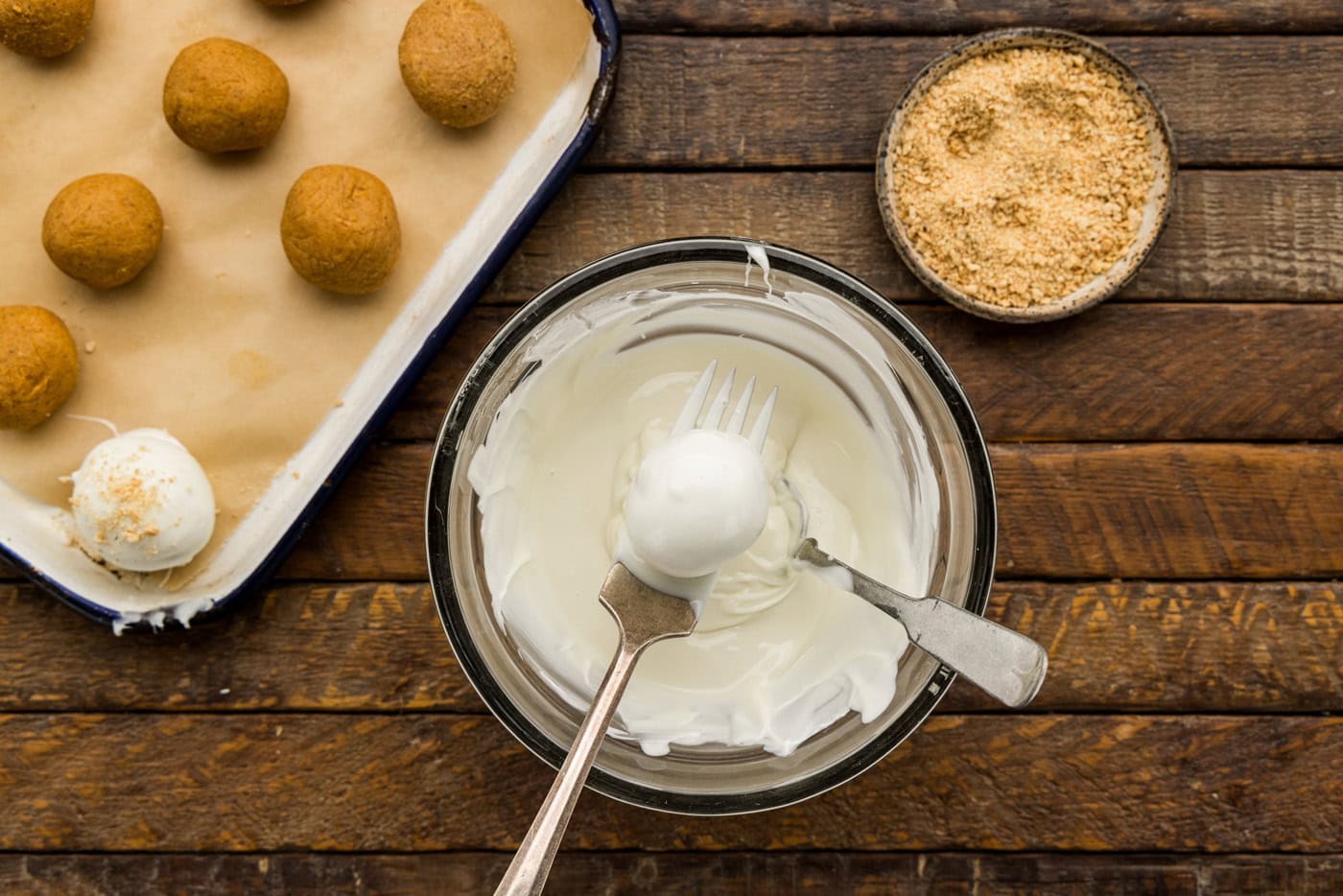dipping Pumpkin Truffles in white chocolate