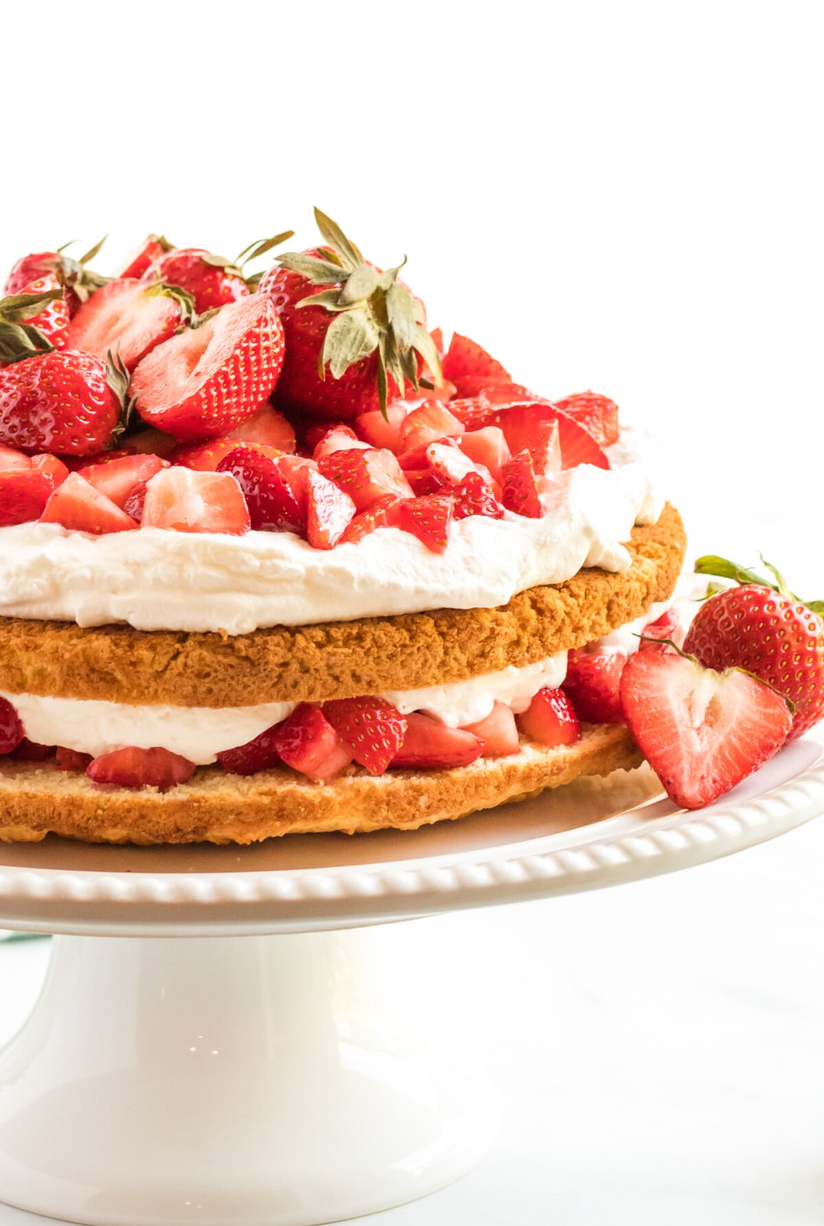 strawberry shortcake cake on a cake plate