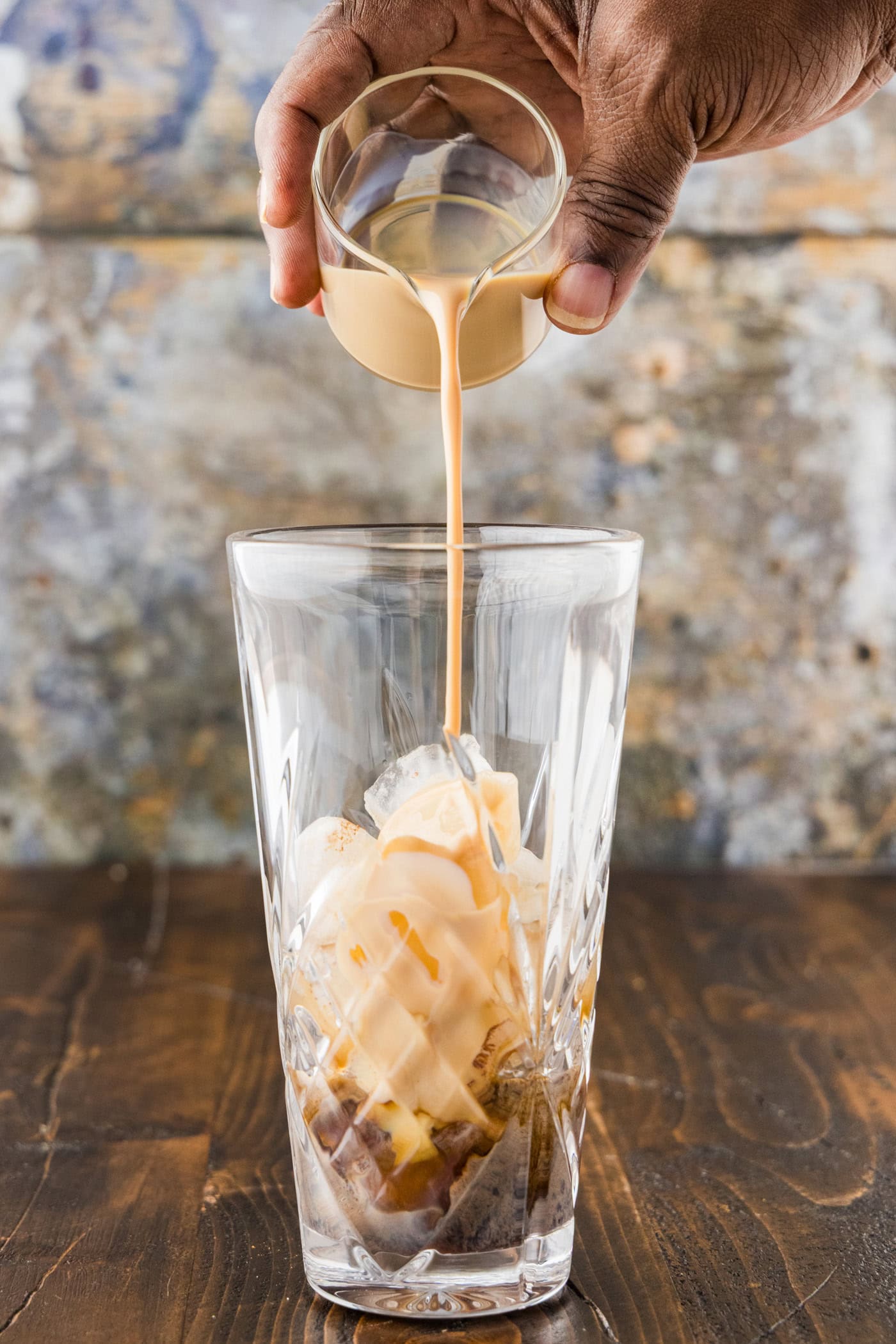 Irish cream poured into the cocktail shaker